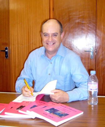 Keith Arkell signs books for members