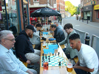 City Chess club playing outside Spin The Black Circle