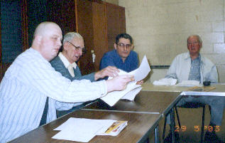 Club members (left to right) Stuart Barber, Alan  Copeman, Tony Spittle and Pat Greenow discuss a point at the 2003 AGM