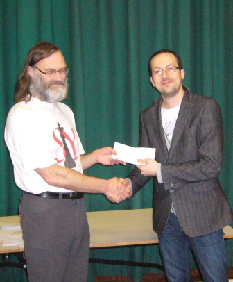 Rob Sutton receives his prize from Dave Thomas