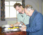 Andrew Moore (left) and ray Dolan (right) check the prize winners' list
