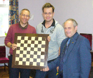 John Pitcher (left) with the Open trophy presented by Andrew Moore (centre) and Ray Dolan (right)