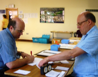 Andrew Farthing and Colin Reed check the prize lists