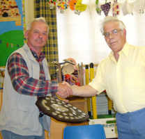 Brian Turner (left) receives the Division 1 shield from President Maurice Nissell