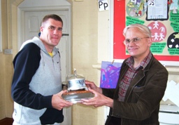 Jason Cole receives the Cobham trophy from President Peter Kitson for Redditch, Division Two Champions.