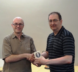 Kevin Hurney, right receives trophy from Andrew Farthing 