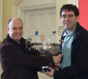 Keith Arkell (left) presents Geoffrey Herbert, Malvern captain, the Bonham Rose Bowl